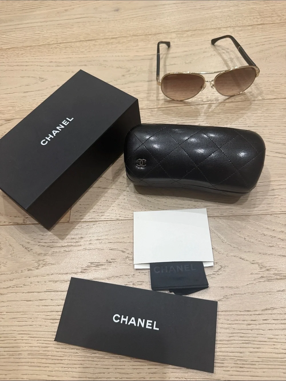 CHANEL Gold Frame Brown Lens Aviator Sunglasses with Black Temple Tips
